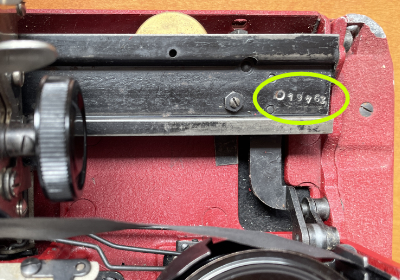 Location of the number stamped on 1950 Gossen Tippa typewriter carriage rails